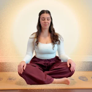 woman sitting in meditation pose